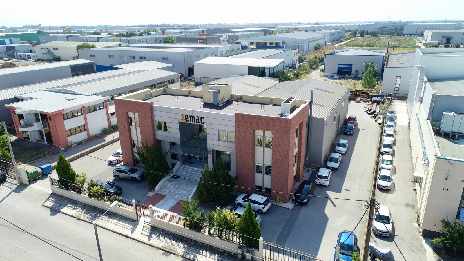 The SEMAC office building from the side, with the smaller industrial space behind it
